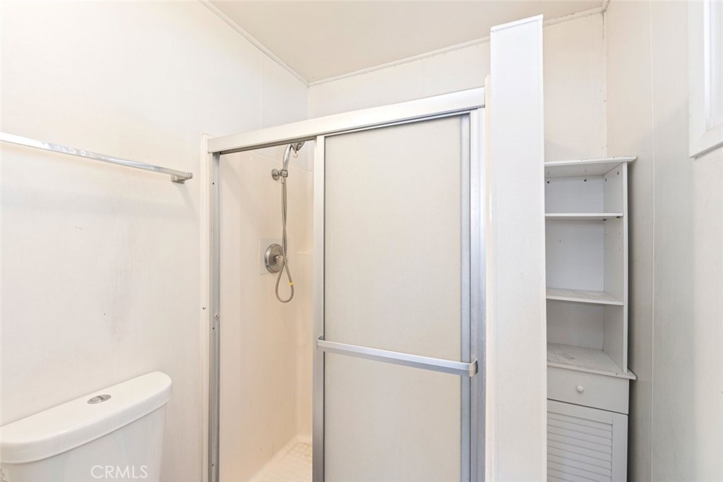 5663 Osburn Place Riverside, CA 92506 - Photo 18 of 38 a bathroom with a shower and a toilet