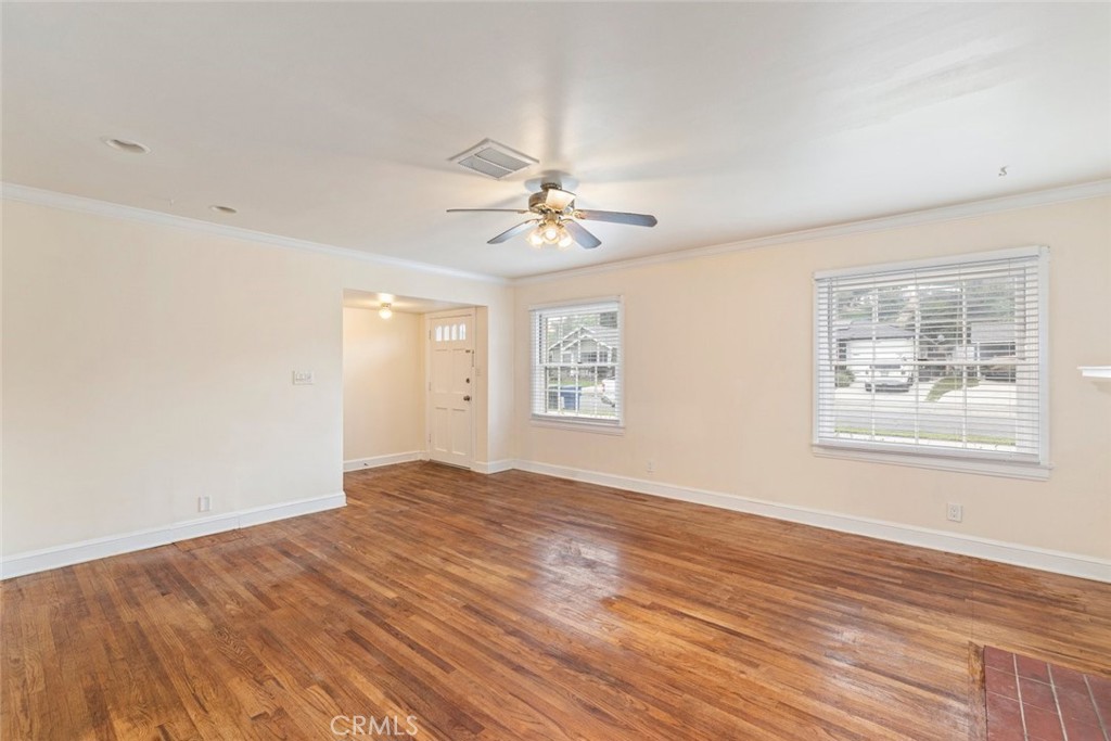 5663 Osburn Place Riverside, CA 92506 - Photo 9 of 38 wooden floor in an empty room with a window
