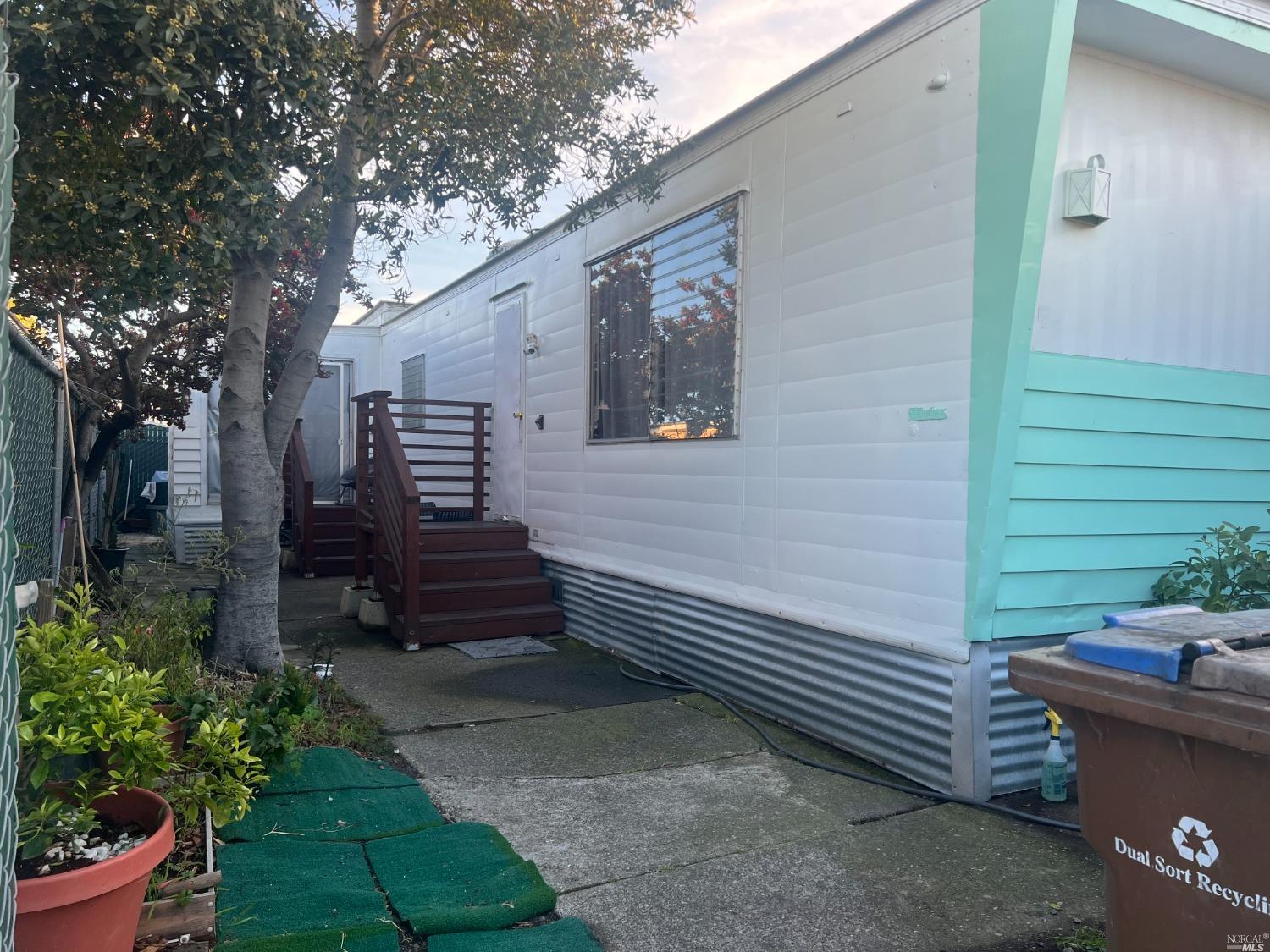 2130 Redwood Highway, Unit F5 Greenbrae, CA 94904 - Photo 1 of 20 a view of a house with a yard