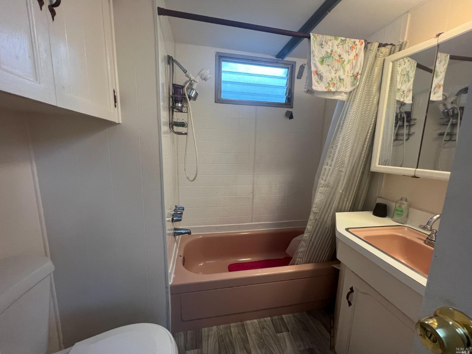 2130 Redwood Highway, Unit F5 Greenbrae, CA 94904 - Photo 11 of 20 a bathroom with a toilet and a shower