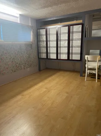 an empty room with a fireplace