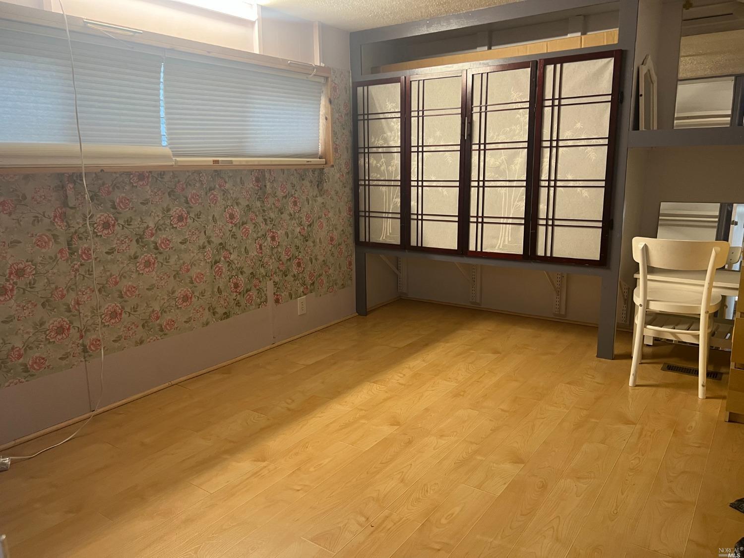 2130 Redwood Highway, Unit F5 Greenbrae, CA 94904 - Photo 13 of 20 a view of an empty room with a window