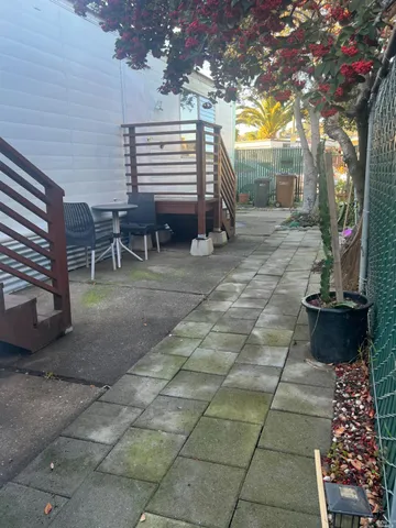 a backyard of a house with seating space