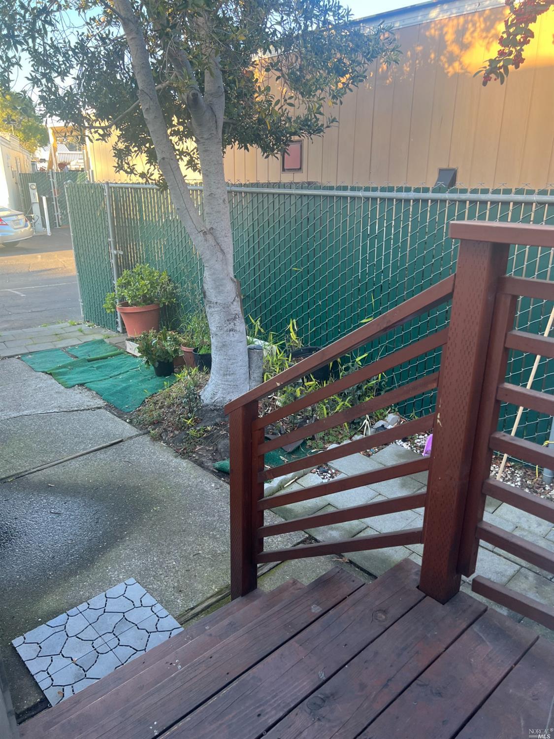 2130 Redwood Highway, Unit F5 Greenbrae, CA 94904 - Photo 2 of 20 a view of a bench in a garden