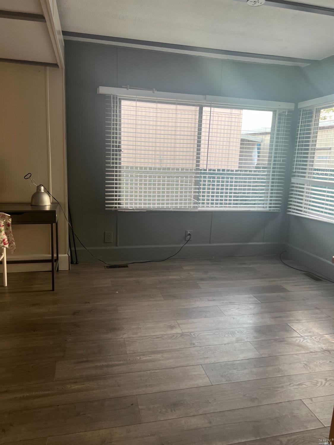 2130 Redwood Highway, Unit F5 Greenbrae, CA 94904 - Photo 8 of 20 a view of room with window and hardwood floor