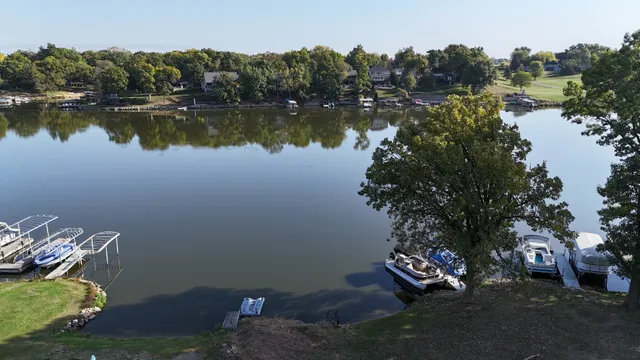 a view of a lake with a forest