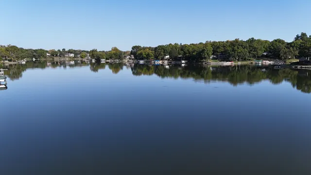 a view of lake with residential houses with outdoor space and lake view