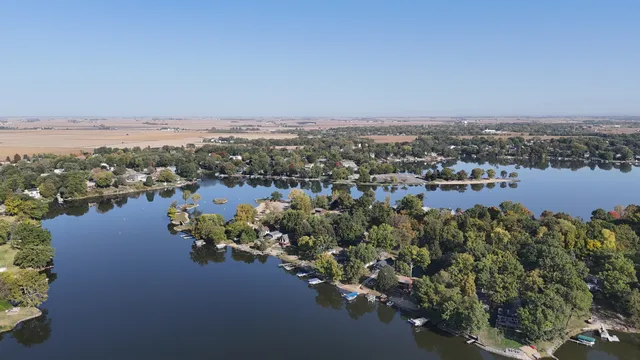 an aerial view of a houses with city view