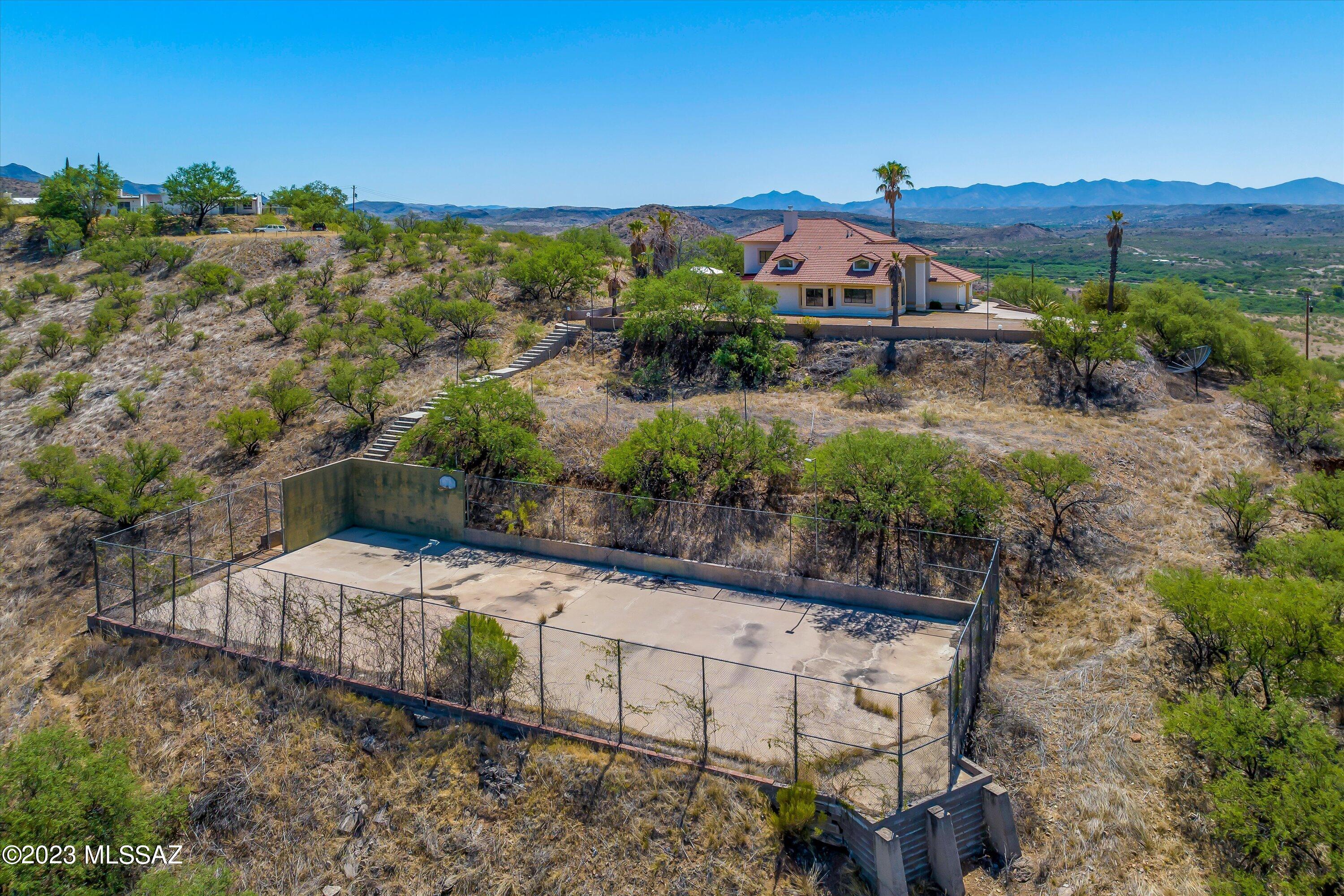 1226 Avenida Gloriosa Rio Rico, AZ 85648 - Photo 42 of 46 a view of a houses with a yard