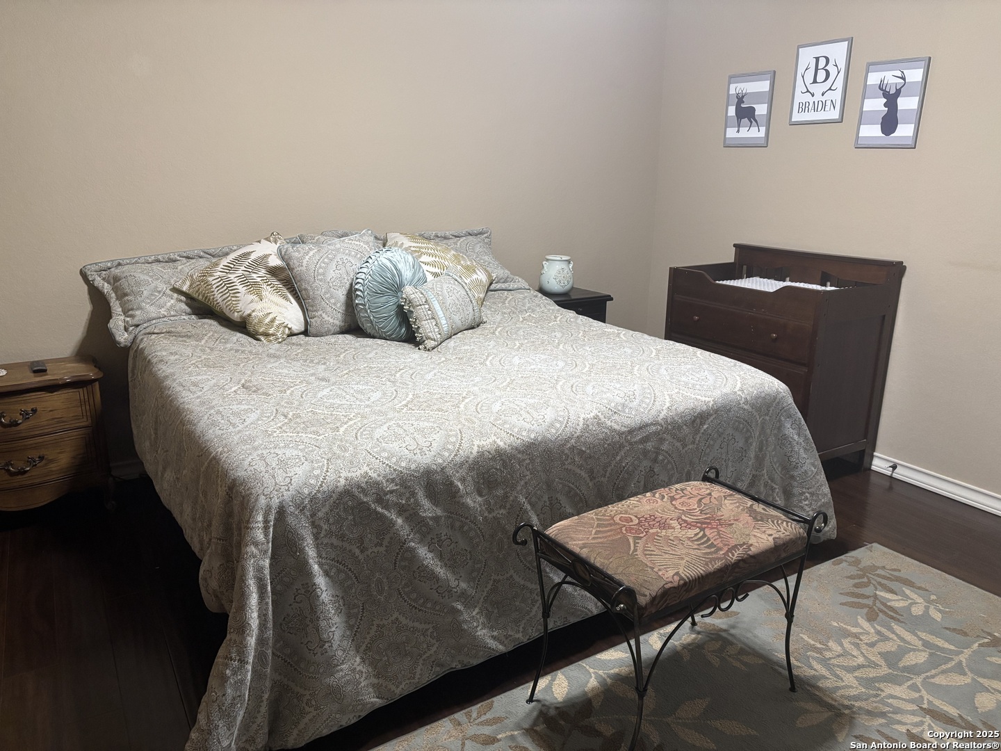 104 Park View Poth, TX 78147 - Photo 21 of 54 a bedroom with a bed and a lamp on table