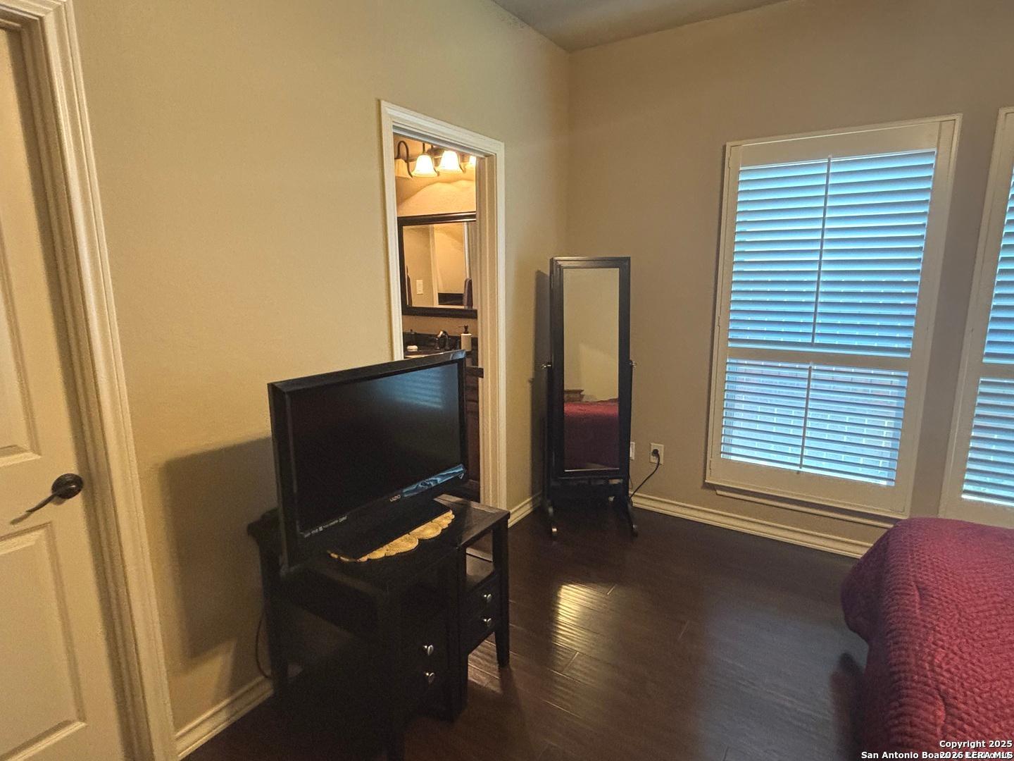 104 Park View Poth, TX 78147 - Photo 32 of 54 a living room with furniture and a flat screen tv