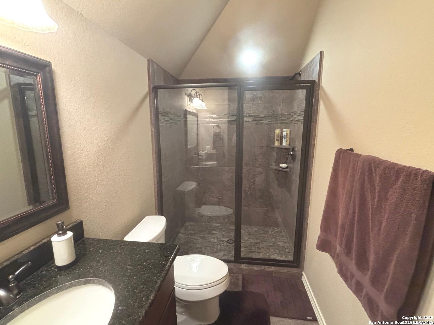 104 Park View Poth, TX 78147 - Photo 47 of 54 a bathroom with a granite countertop sink toilet and shower