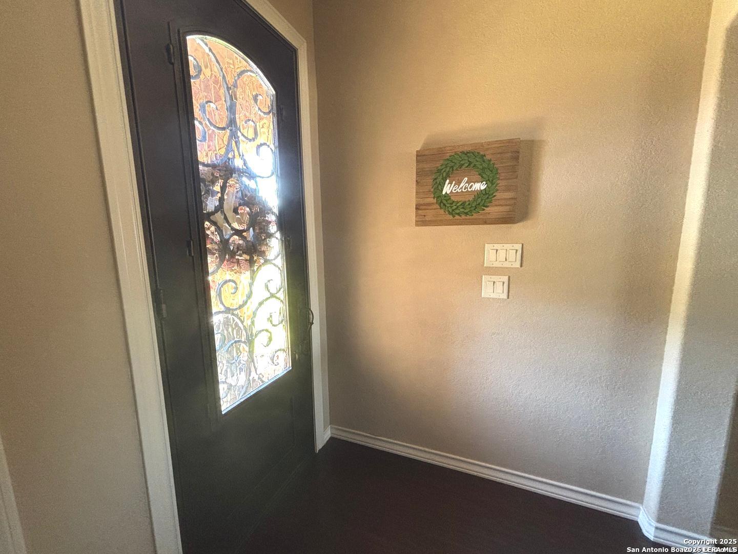 104 Park View Poth, TX 78147 - Photo 6 of 54 an entryway with a window and a mirror
