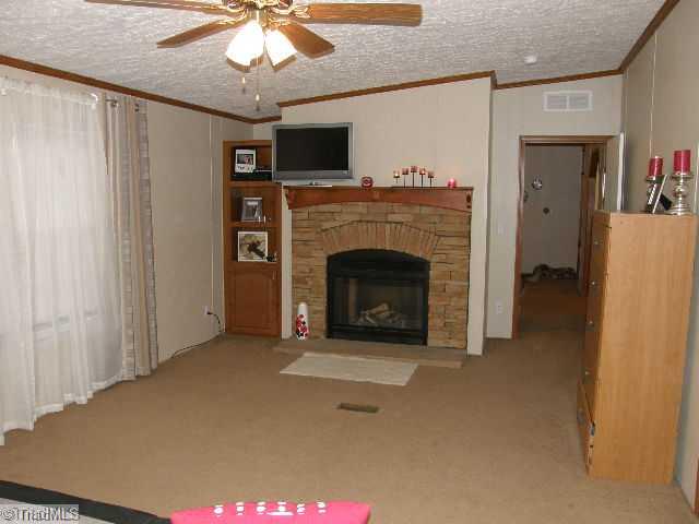 2253 Nebo Road Boonville, NC 27011 - Photo 7 of 9 Master Bedroom. Master bedroom with gas log fireplace.