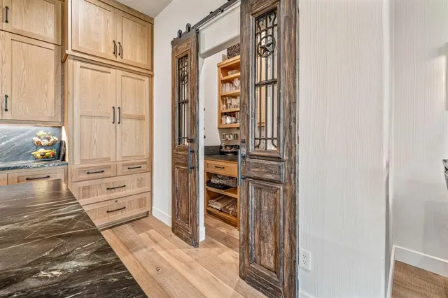 a view of a bedroom with furniture and window