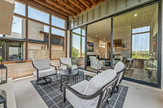 a view of a dining room with furniture wooden floor and a chandelier