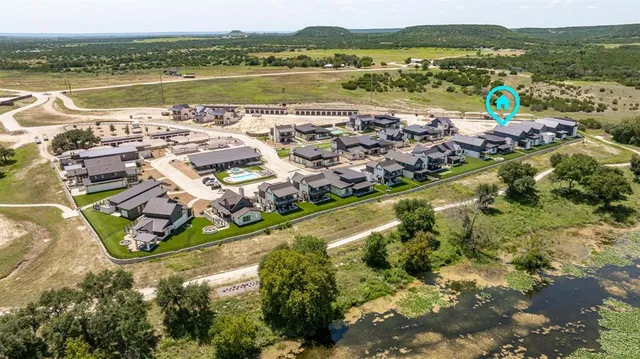 an aerial view of a house with a lake view