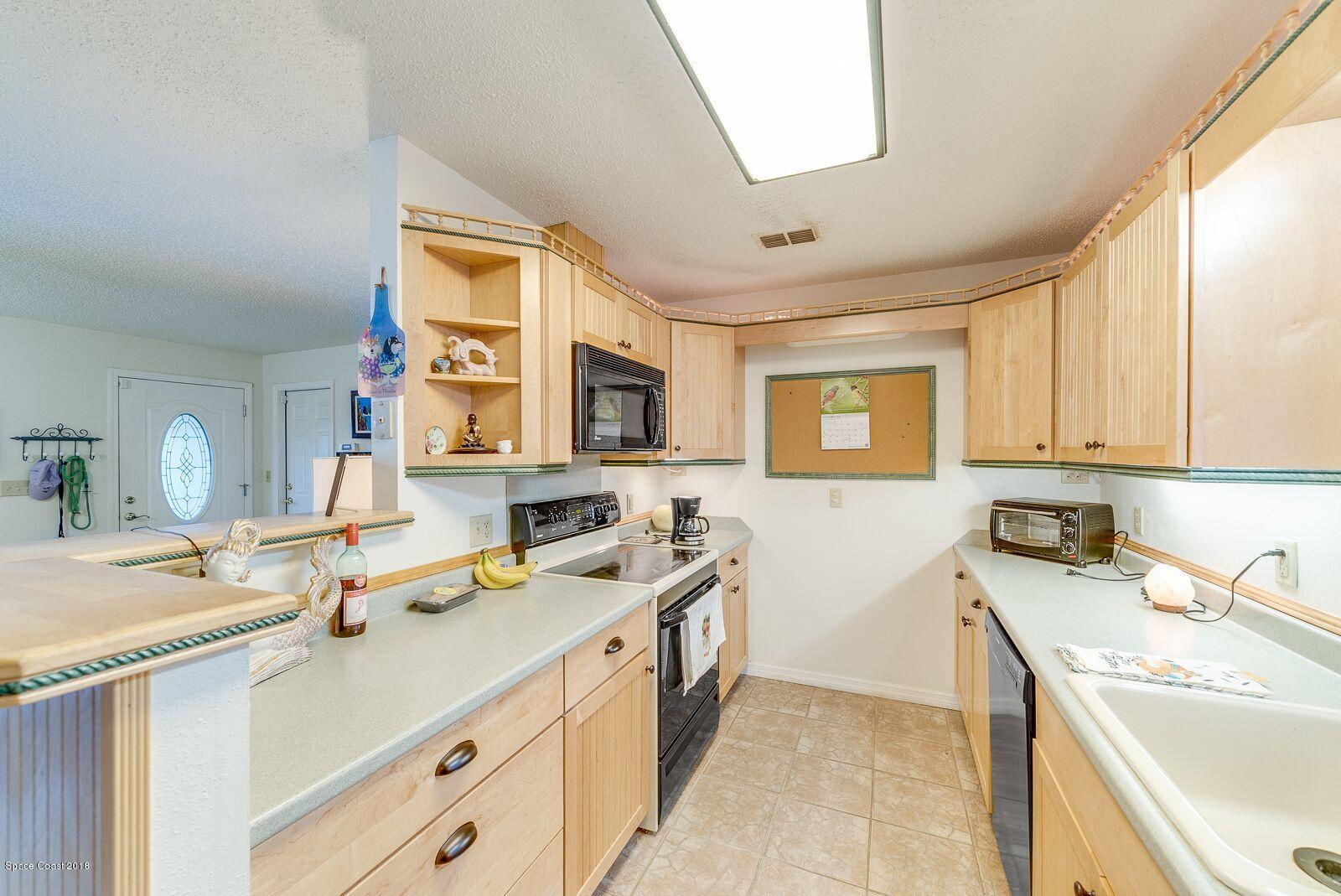 939 Raleigh Road Southeast Palm Bay, FL 32909 - Photo 11 of 30 LLV KITCHEN 1