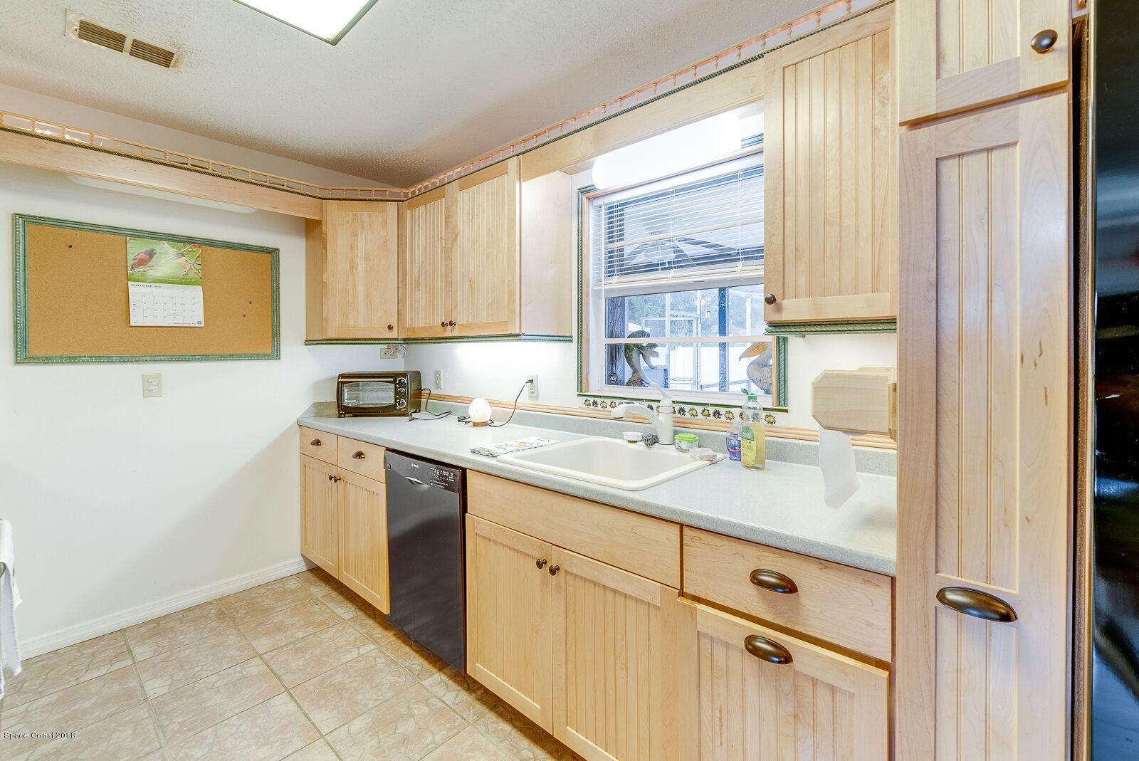 939 Raleigh Road Southeast Palm Bay, FL 32909 - Photo 12 of 30 LLV KITCHEN 2