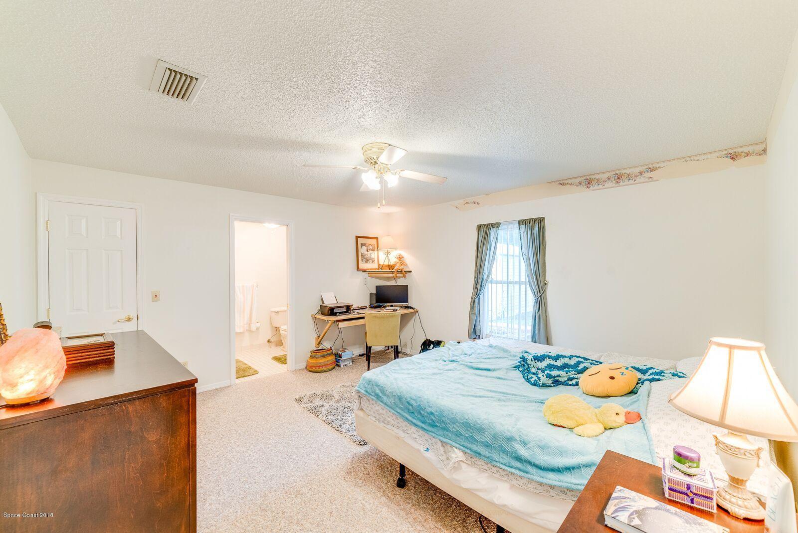 939 Raleigh Road Southeast Palm Bay, FL 32909 - Photo 17 of 30 LLV MASTER BEDROOM