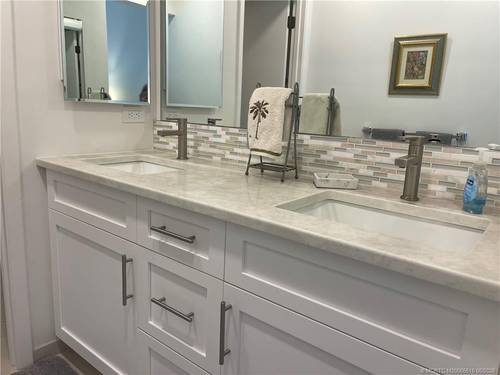 1858 Southwest Palm City Road, Unit 203 Stuart, FL 34994 - Photo 16 of 21 a close view of sink and mirror