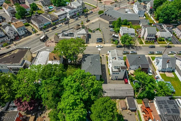 an aerial view of multiple houses with yard