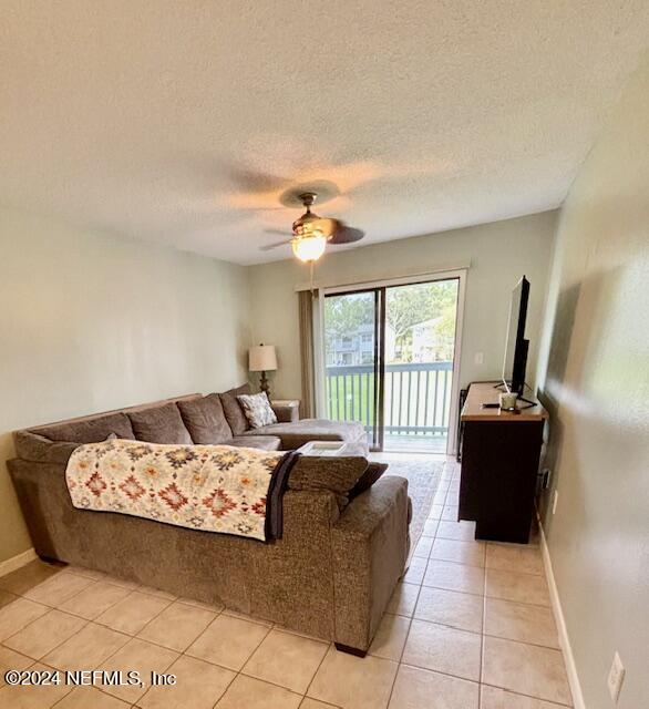 700 West Pope Road, Unit M104 St. Augustine, FL 32080 - Photo 12 of 35 a bedroom with a bed and a couch