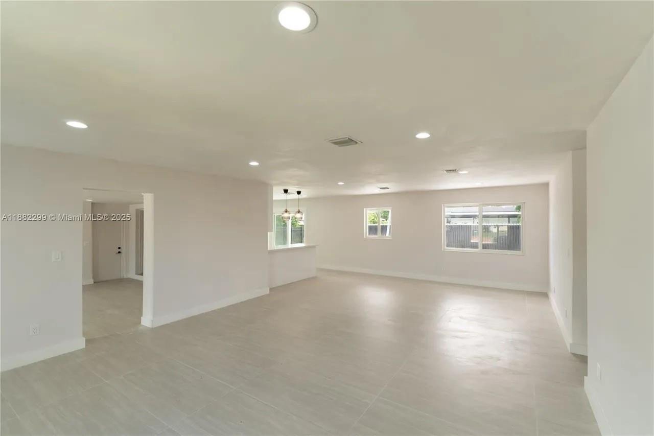 11872 Southwest 196th Terrace Miami, FL 33177 - Photo 13 of 15 an empty room with windows and entrance