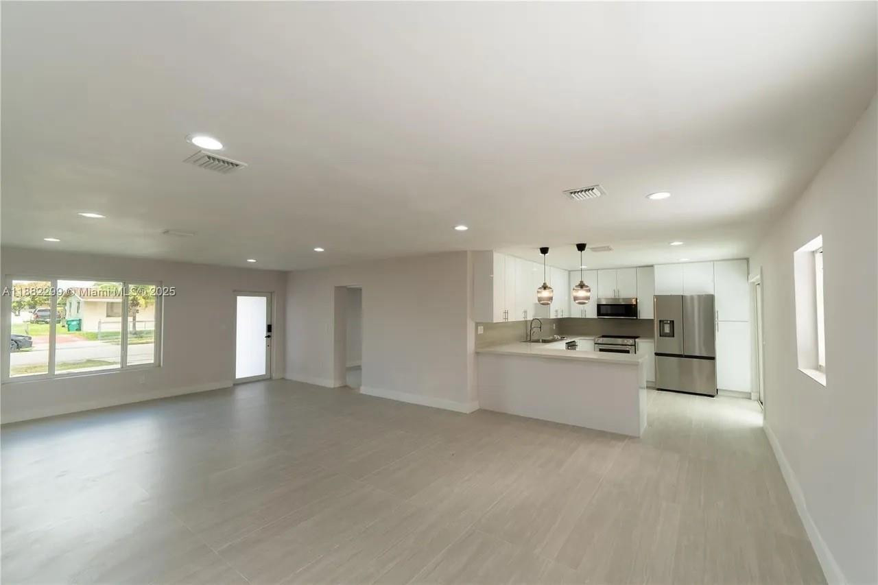 11872 Southwest 196th Terrace Miami, FL 33177 - Photo 14 of 15 a large kitchen with a large counter top appliances and cabinets