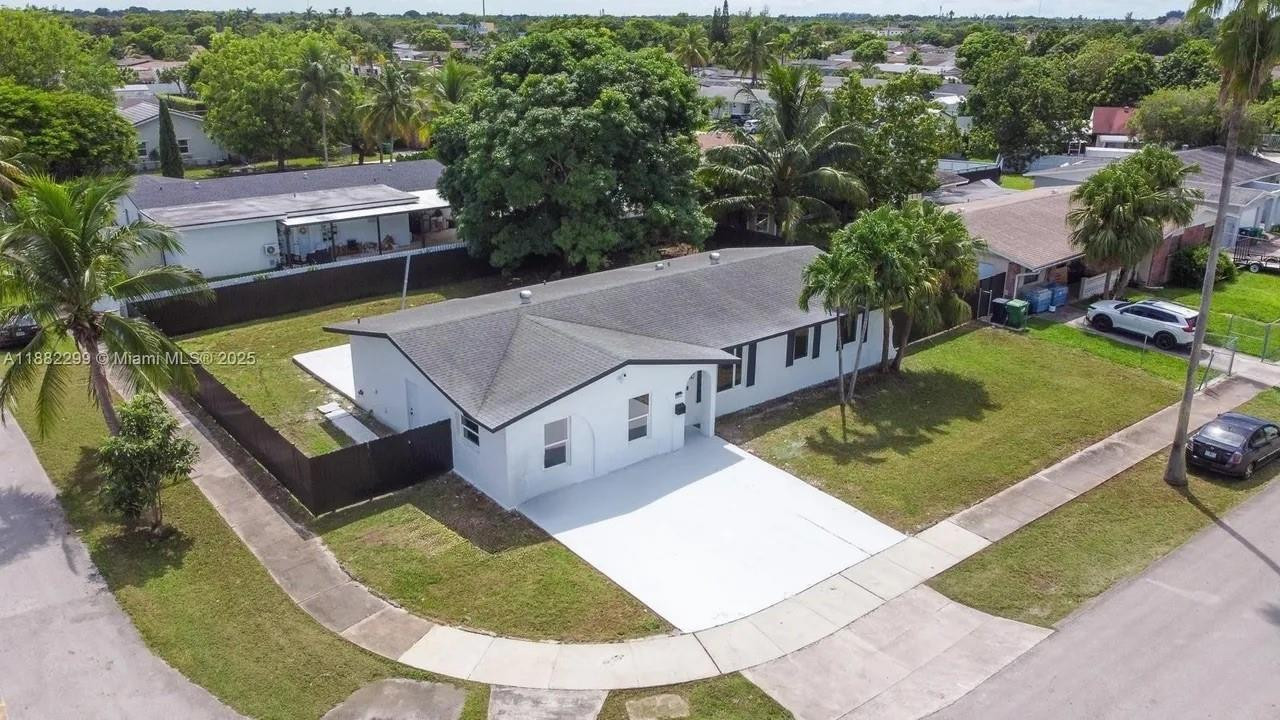 11872 Southwest 196th Terrace Miami, FL 33177 - Photo 15 of 15 an aerial view of a house with swimming pool and outdoor seating