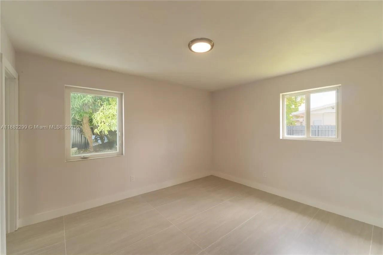 11872 Southwest 196th Terrace Miami, FL 33177 - Photo 6 of 15 an empty room with windows