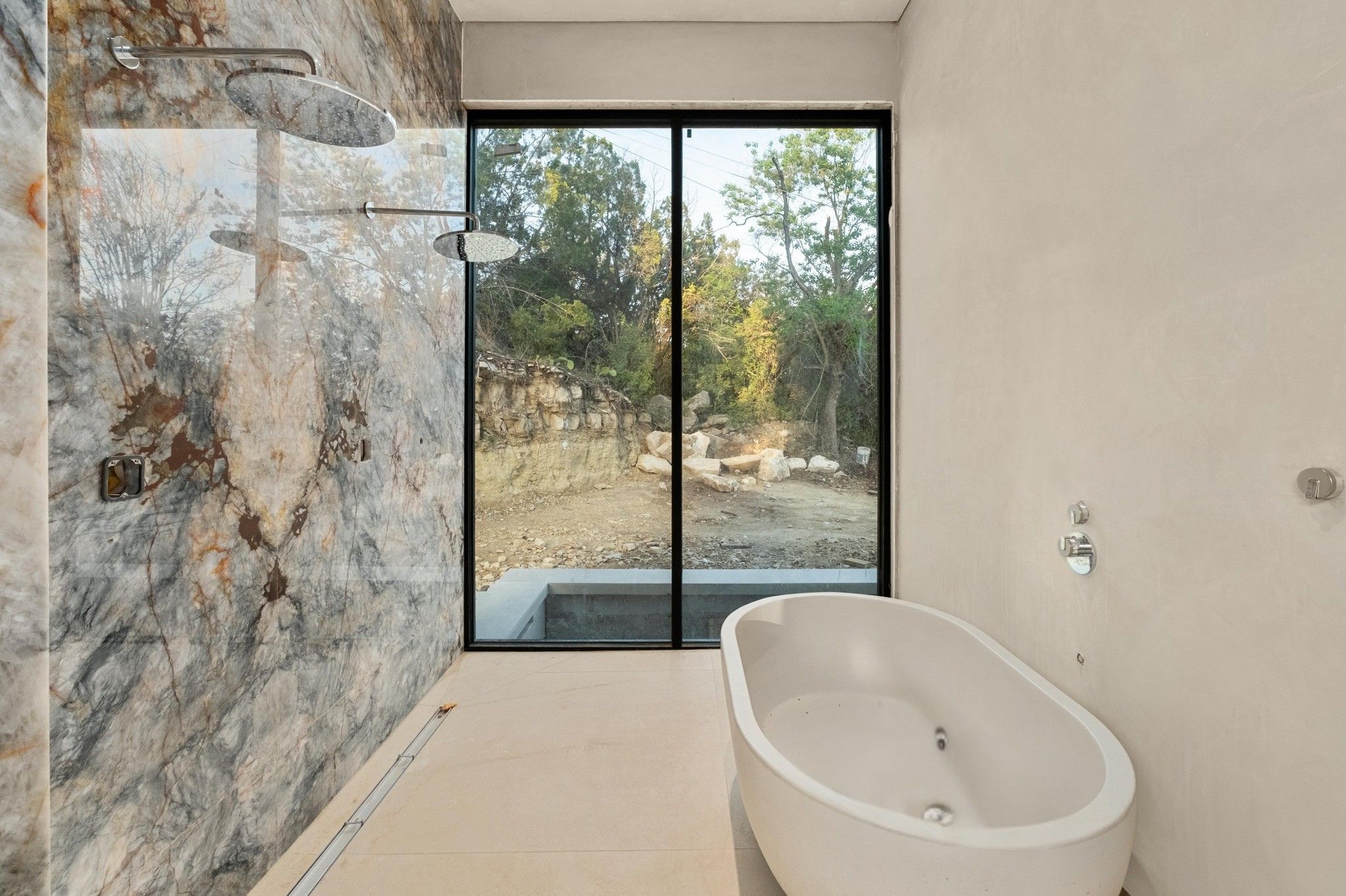 716 Laurel Valley Road West Lake Hills, TX 78746 - Photo 18 of 38 a bathroom with a bathtub and window