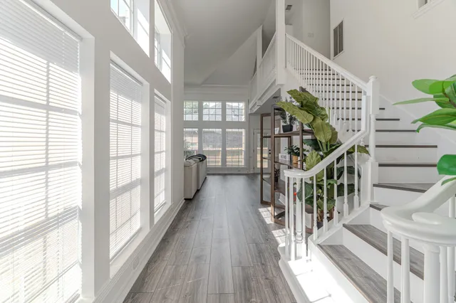 a view of entryway with wooden floor and windows