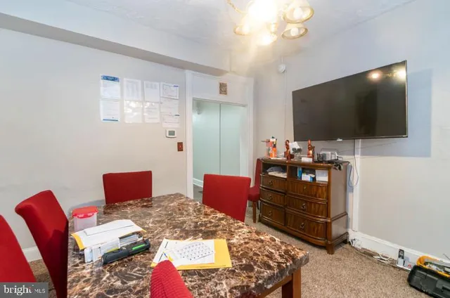 a bedroom with furniture and a flat screen tv