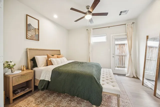 a bed room with a bed and a window