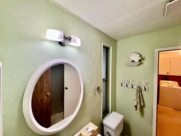 a bathroom with a toilet and a sink