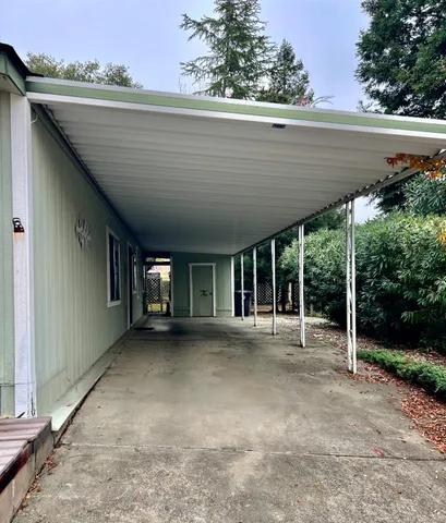a view of an empty room with two windows
