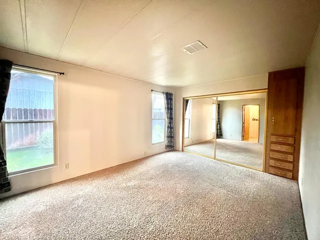 a view of a room with a large window