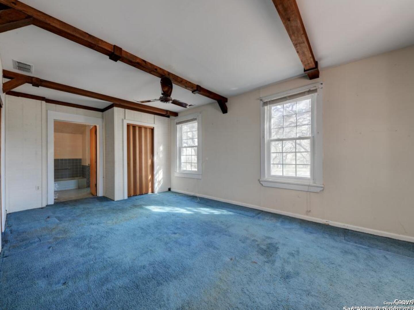 137 Kitty Hawk Road Universal City, TX 78148 - Photo 15 of 25 an empty room with windows