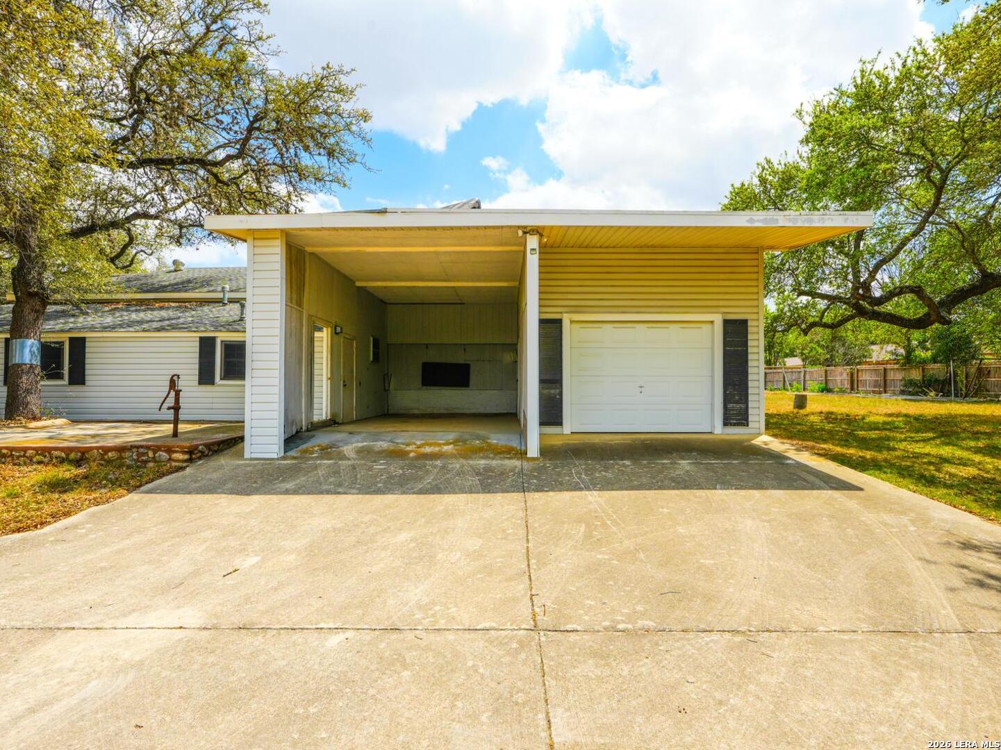 137 Kitty Hawk Road Universal City, TX 78148 - Photo 18 of 25 a view of yellow house with a outdoor space