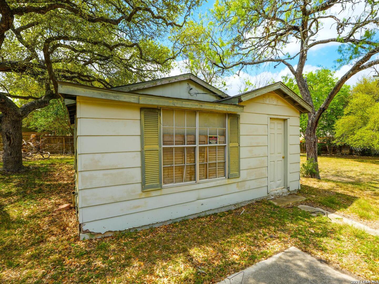 137 Kitty Hawk Road Universal City, TX 78148 - Photo 19 of 25 a front view of a house with a garden