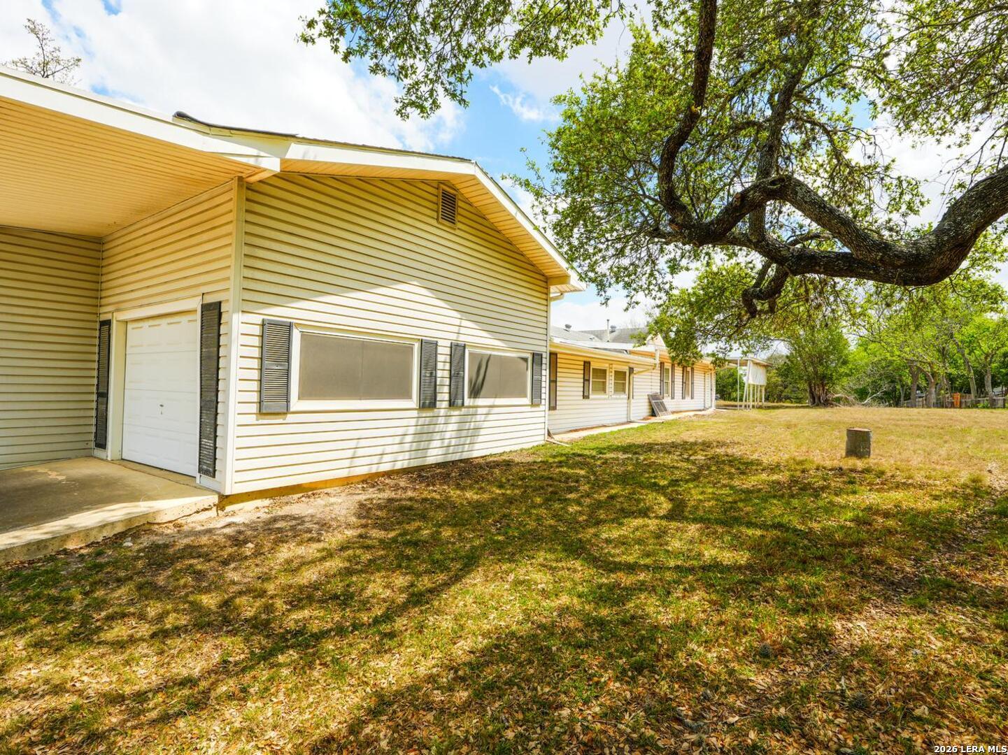 137 Kitty Hawk Road Universal City, TX 78148 - Photo 21 of 25 a view of house that has a small yard