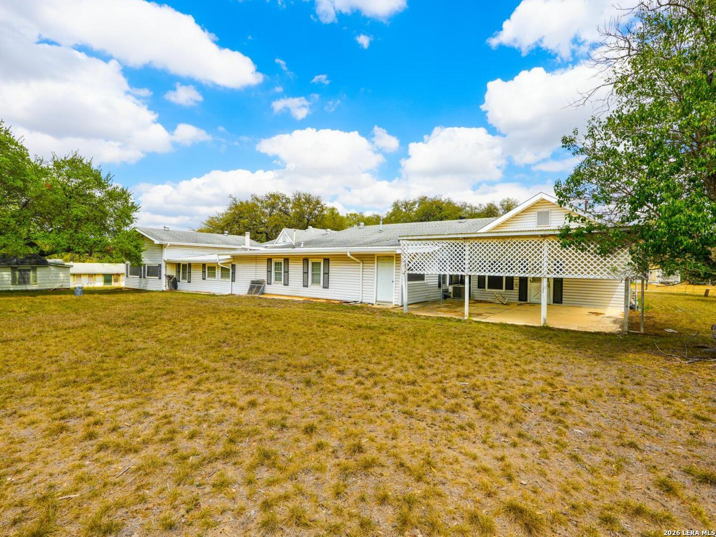 137 Kitty Hawk Road Universal City, TX 78148 - Photo 22 of 25 a front view of a house with a big yard