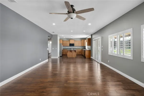a view of dining room with furniture window and wooden floor