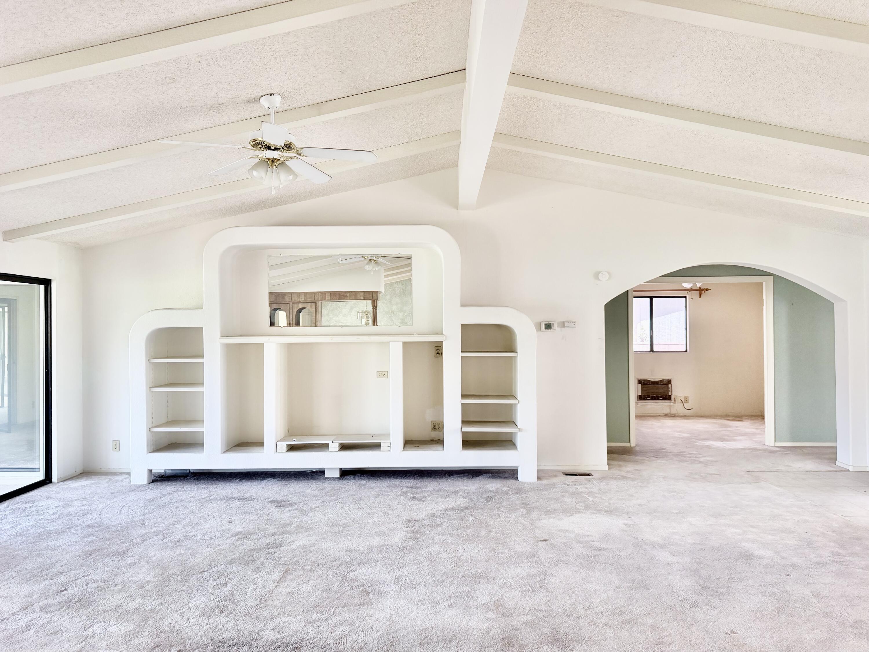 74361 Angel Camp Road Palm Desert, CA 92260 - Photo 6 of 12 an empty room with windows