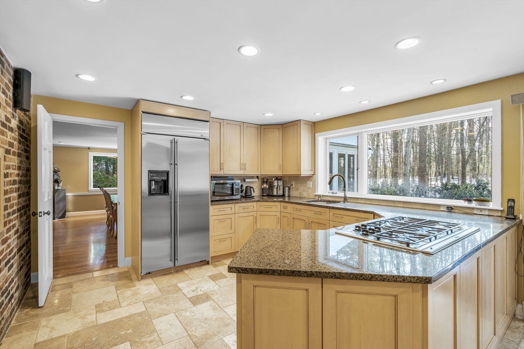 19 Sears Road Wayland, MA 01778 - Photo 12 of 42 a bathroom with a granite countertop sink and glass door