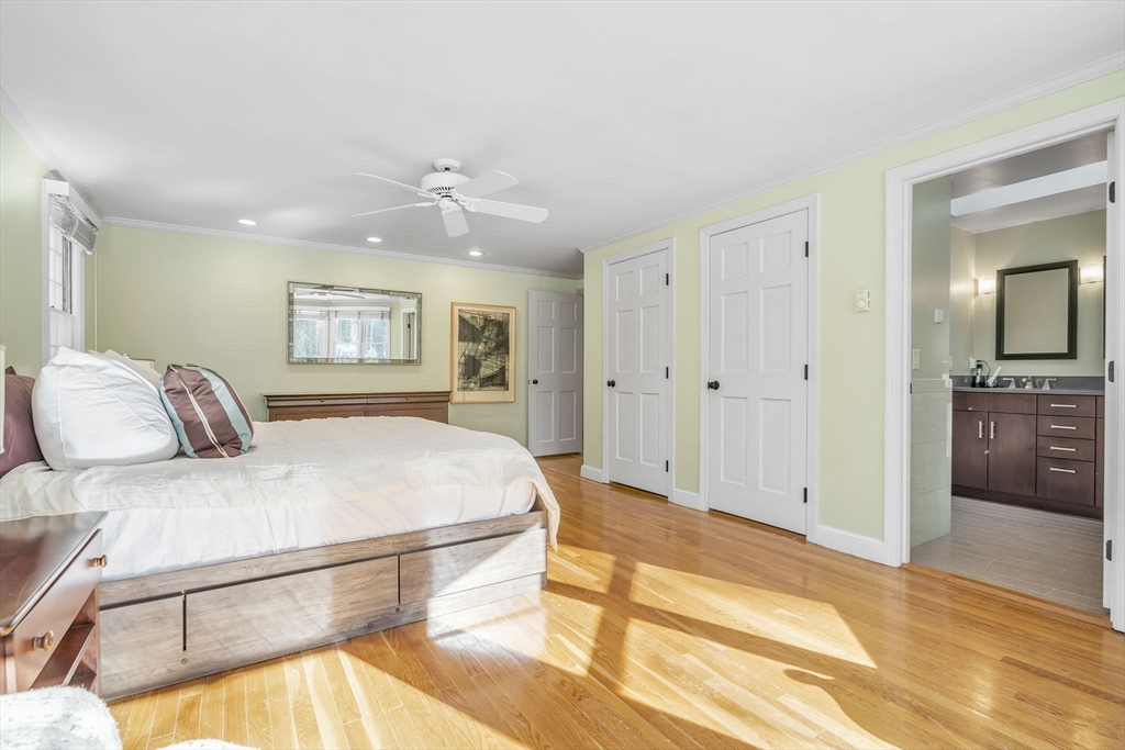 19 Sears Road Wayland, MA 01778 - Photo 21 of 42 a spacious bedroom with a bed and a view of bathroom