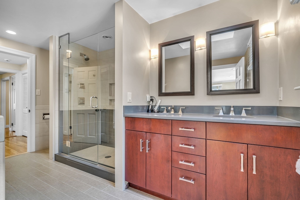 19 Sears Road Wayland, MA 01778 - Photo 24 of 42 a bathroom with double vanity sinks and a shower