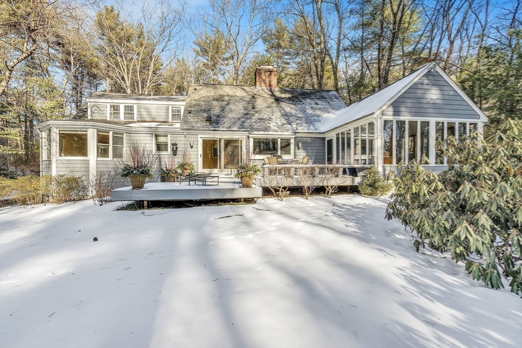 19 Sears Road Wayland, MA 01778 - Photo 38 of 42 a front view of a house with yard and trees in the background