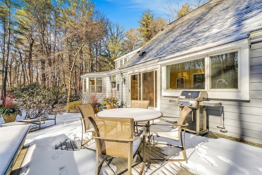 19 Sears Road Wayland, MA 01778 - Photo 40 of 42 a view of a patio with table and chairs and potted plants